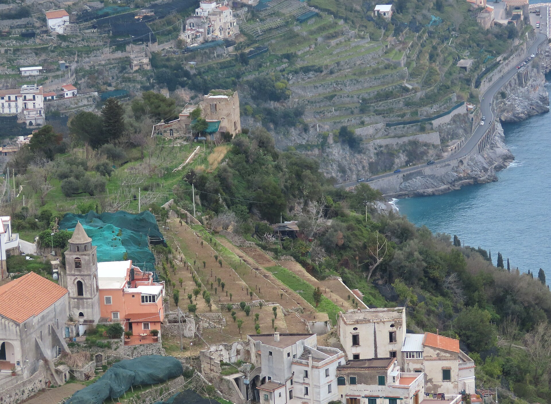 The SS163 coast road curving along steep cliffs above the sea on the Amalfi Coast