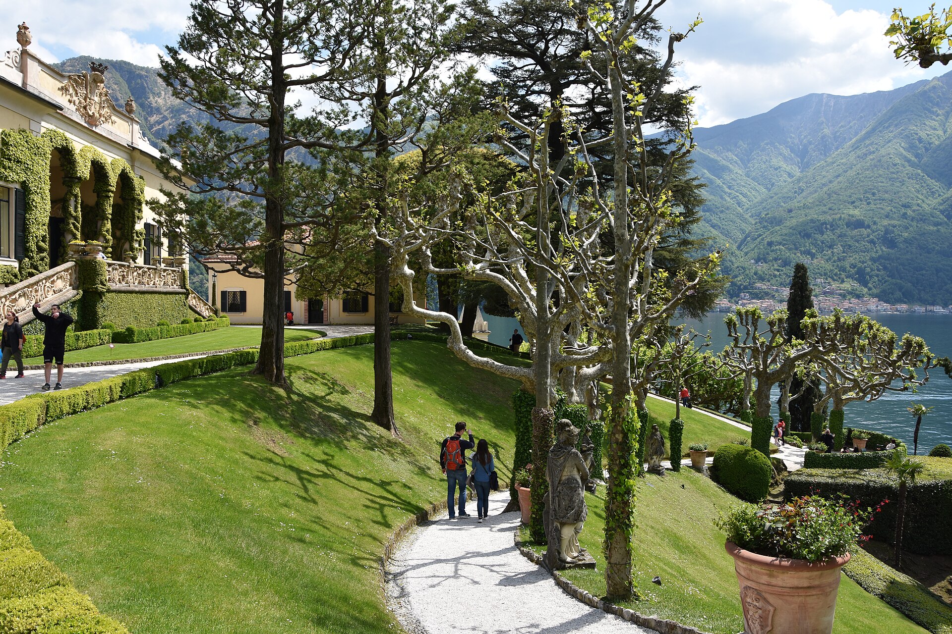 Villa del Balbianello on its wooded promontory near Lenno, with terraced gardens and a loggia overlooking Lake Como on three sides.