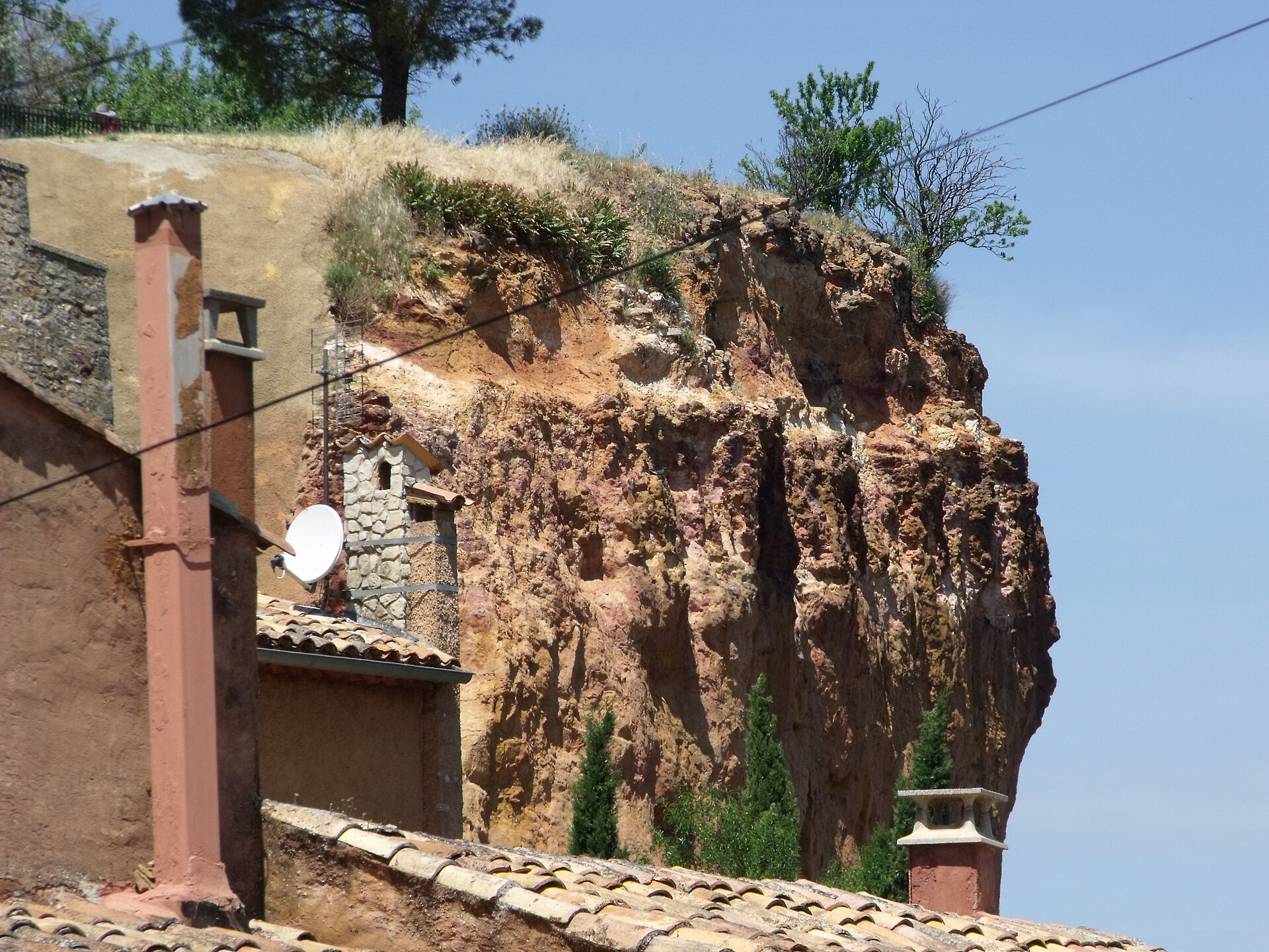 The ochre cliffs and red-toned houses of Roussillon in the Luberon