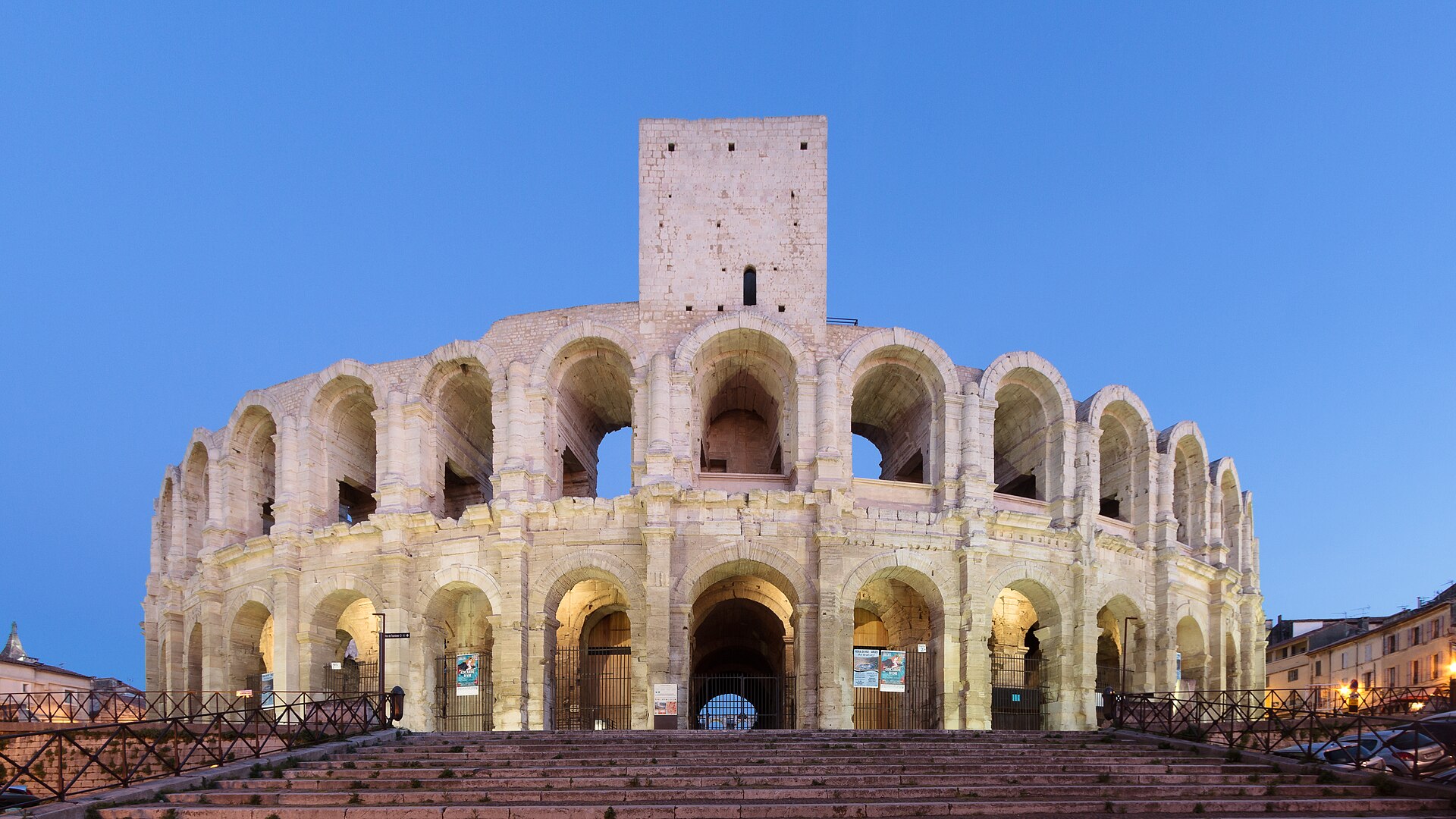 The Roman amphitheater in Arles, its stone arches rising above the old town