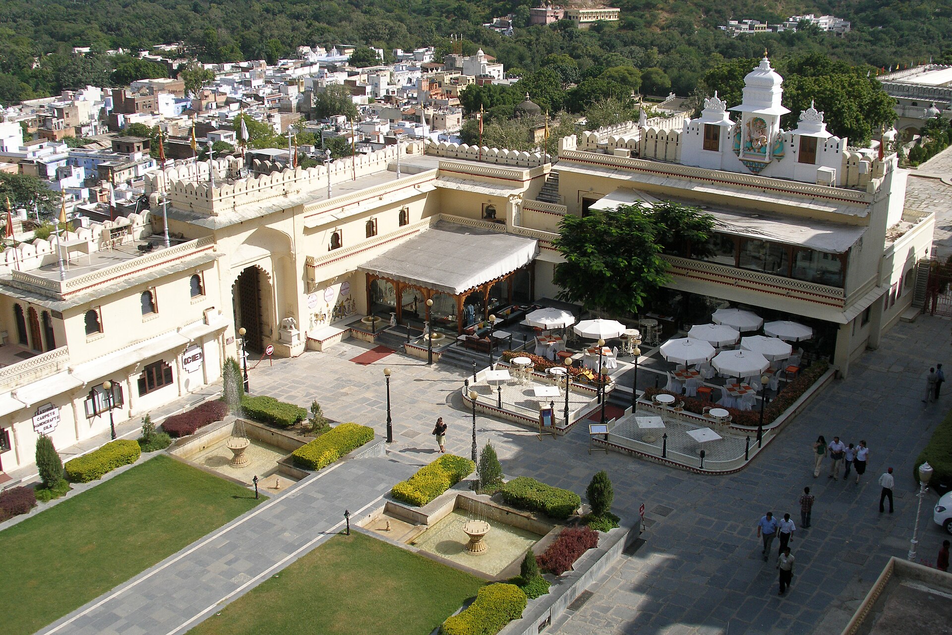A decorated courtyard inside the City Palace of Udaipur with carved balconies and archways