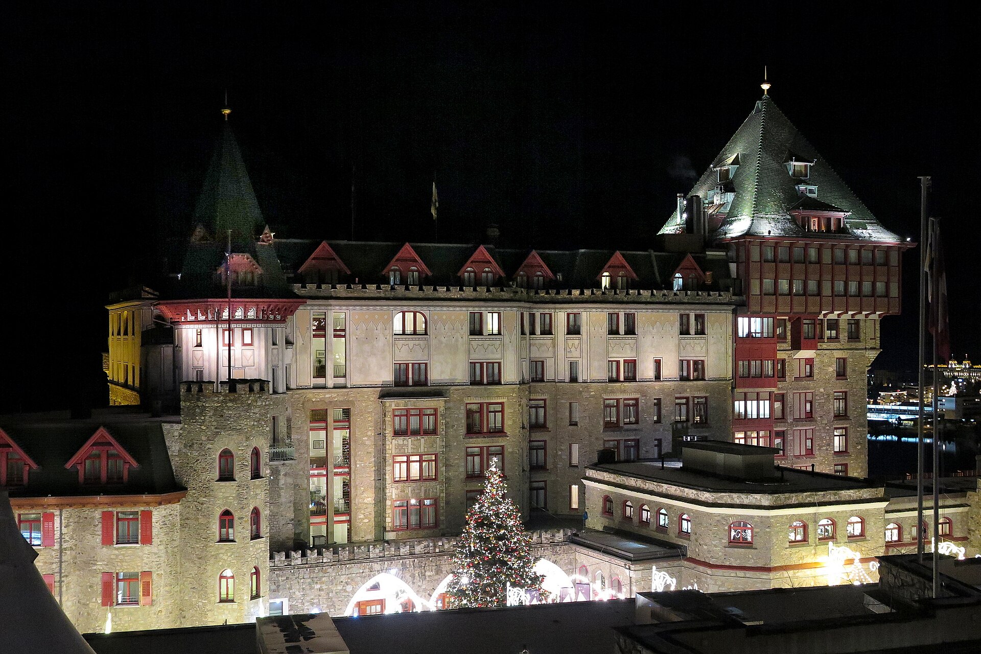 The facade and tower of Badrutt's Palace Hotel above Lake St. Moritz.