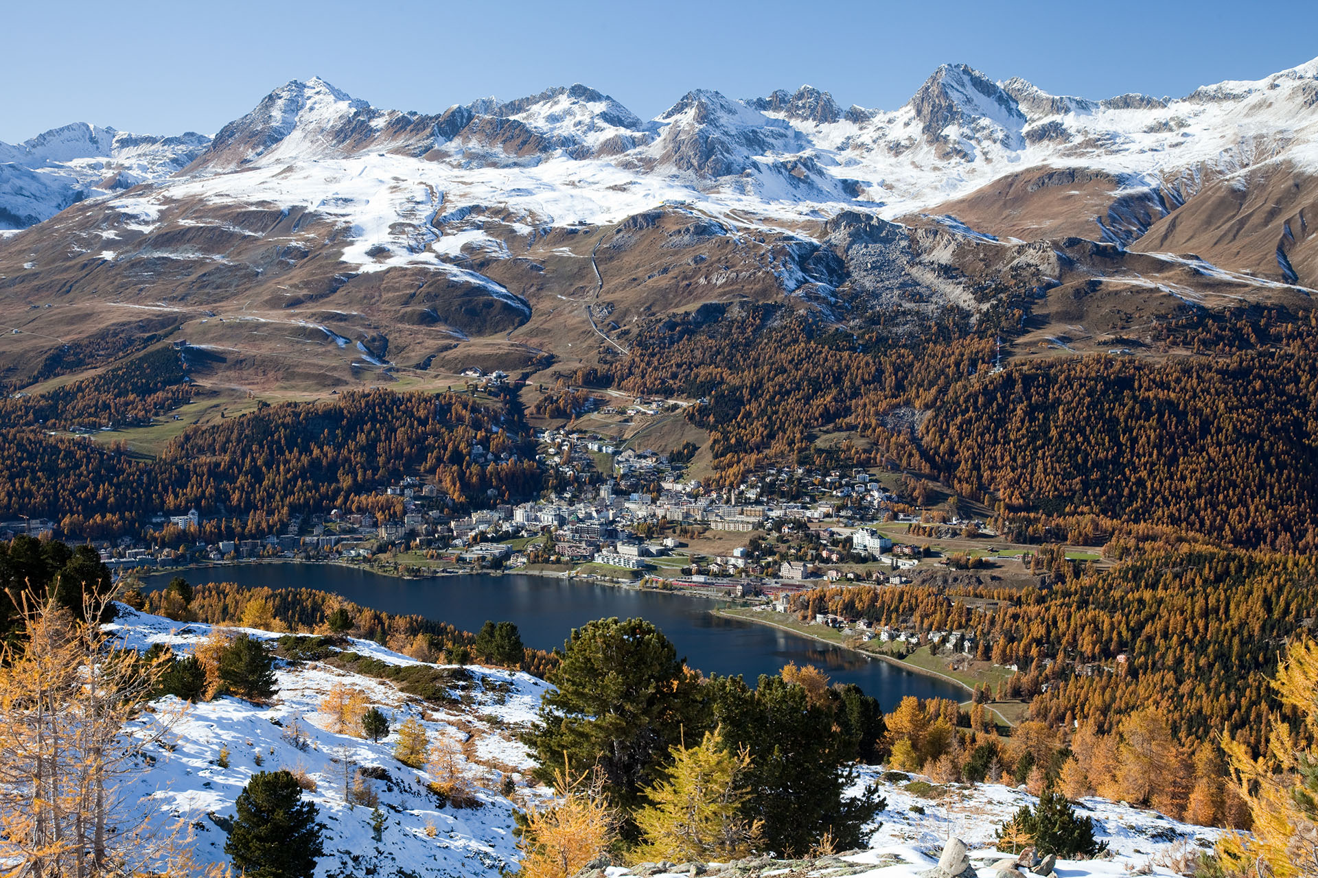 Skiers and the ridgeline at Piz Nair above the Corviglia ski area.