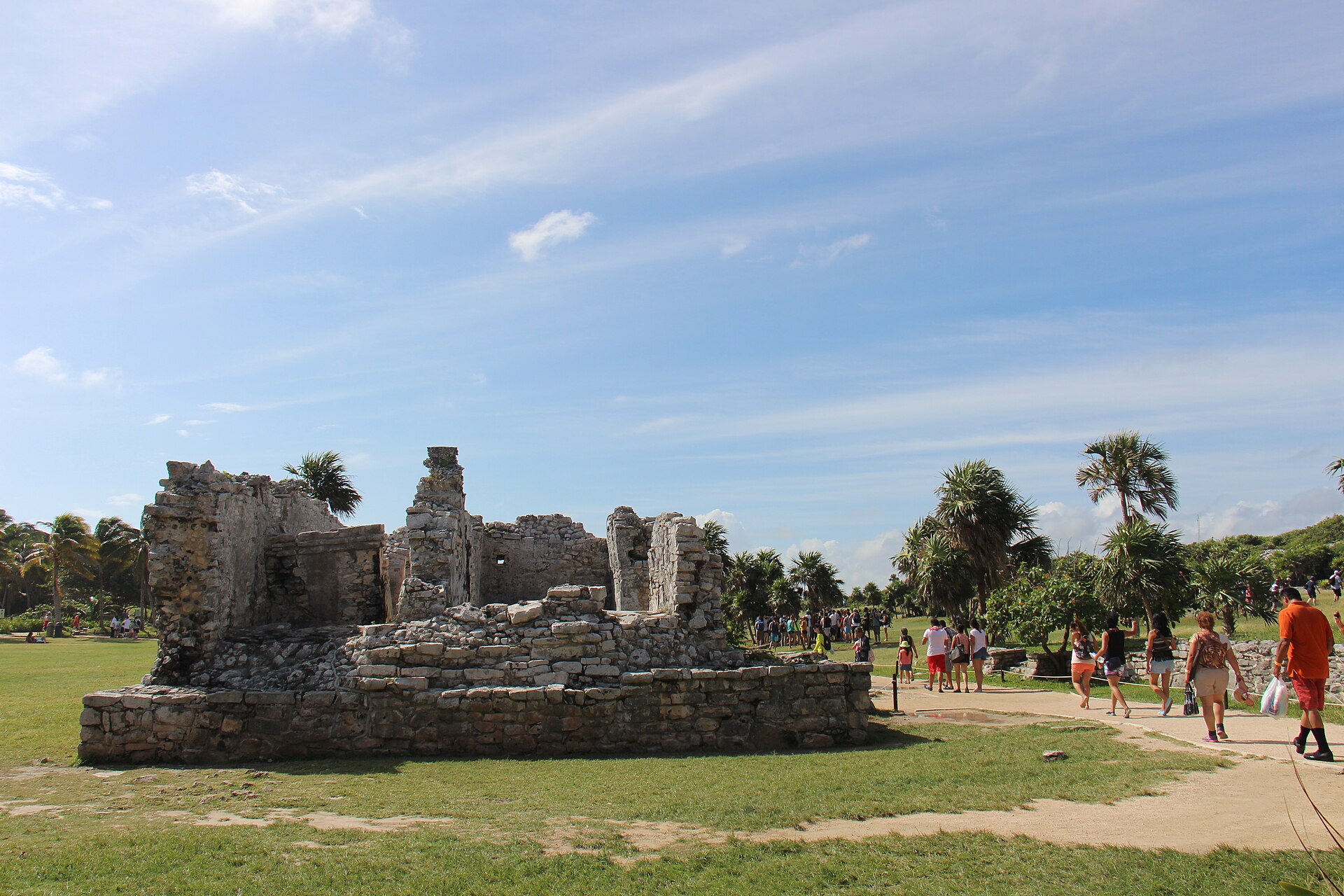 The Maya temple El Castillo standing on a limestone cliff above the turquoise Caribbean at the Tulum ruins