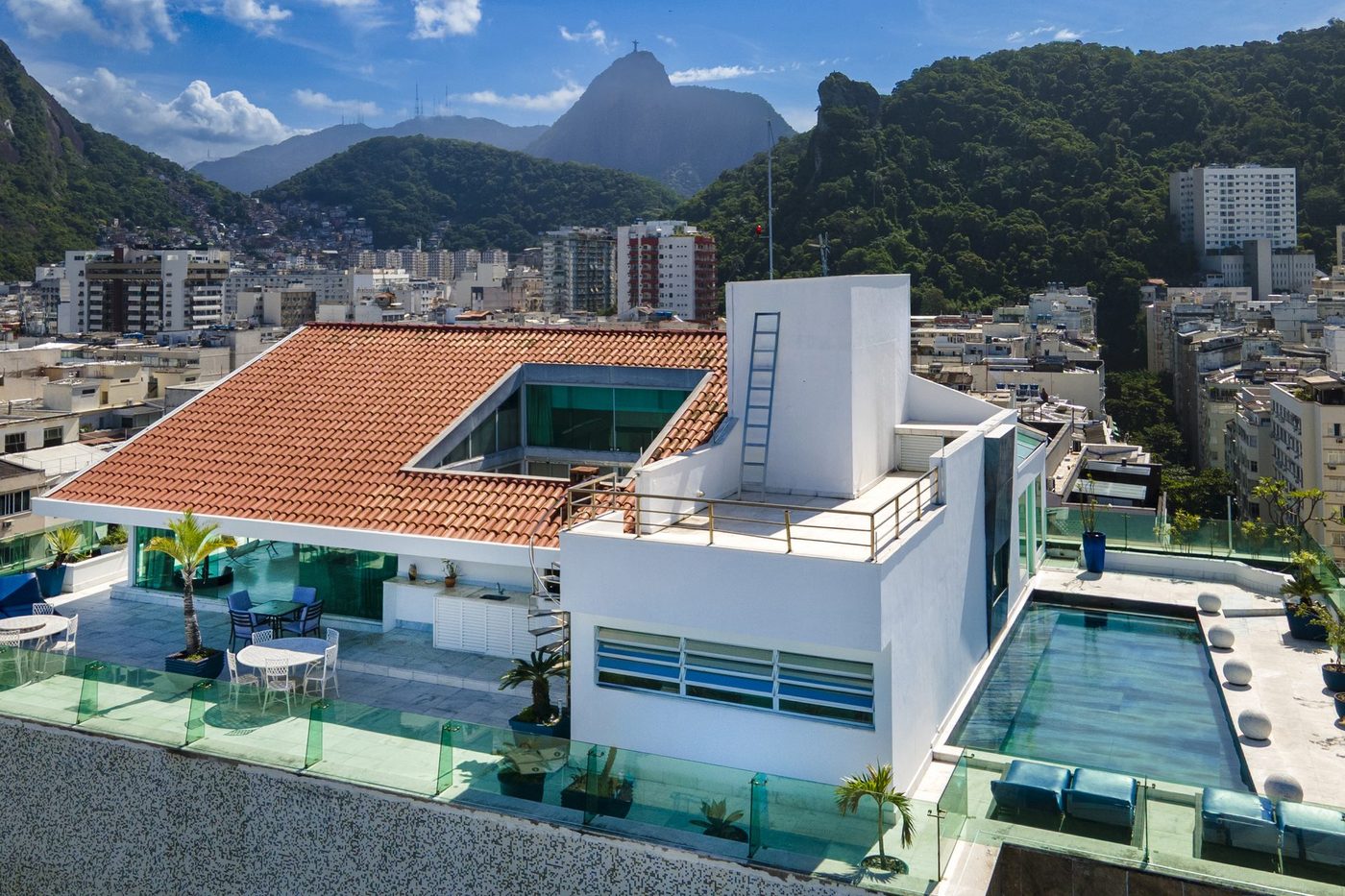 Rooftop terrace and pool with Christ the Redeemer visible on the mountain above Copacabana