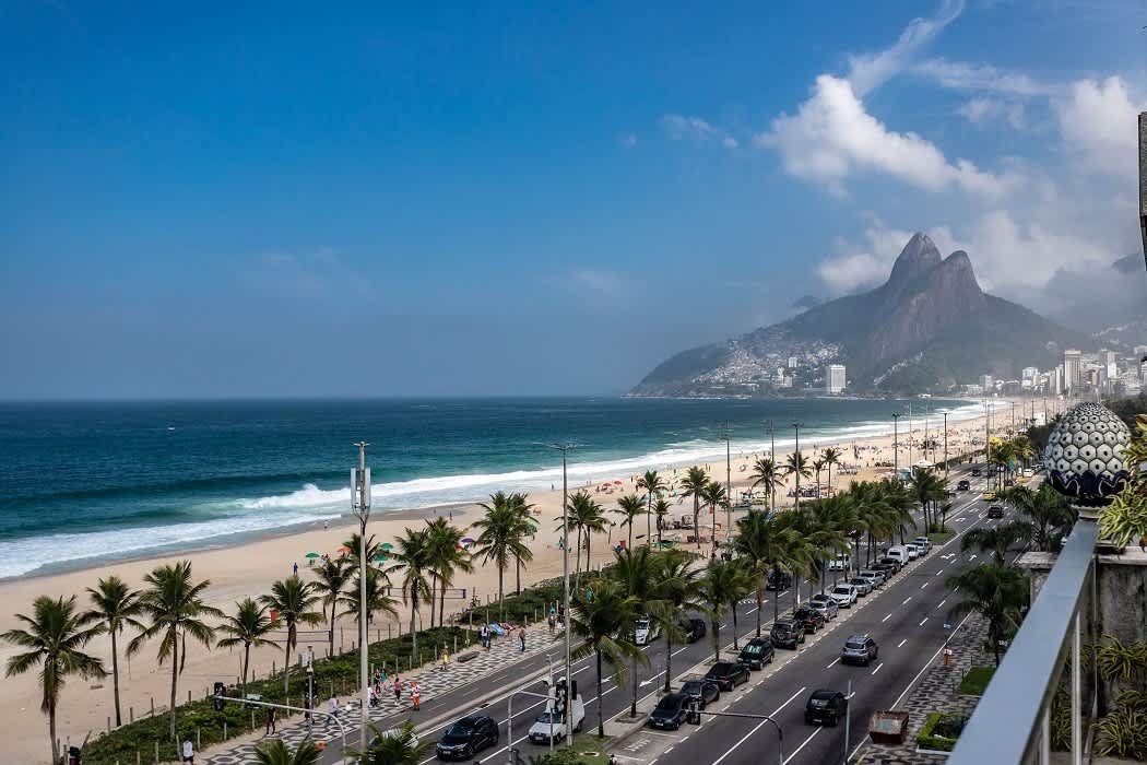 View along Ipanema beach toward the twin peaks of Dois Irmãos, seen from a balcony