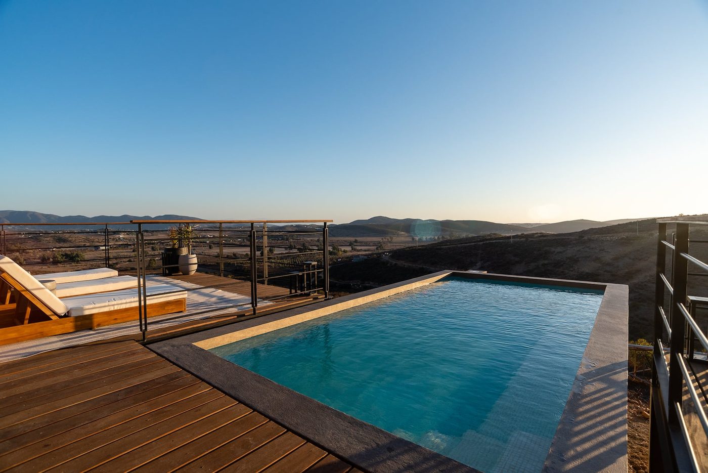 The infinity pool at Casa Finch reaching toward the vineyards of Valle de Guadalupe below