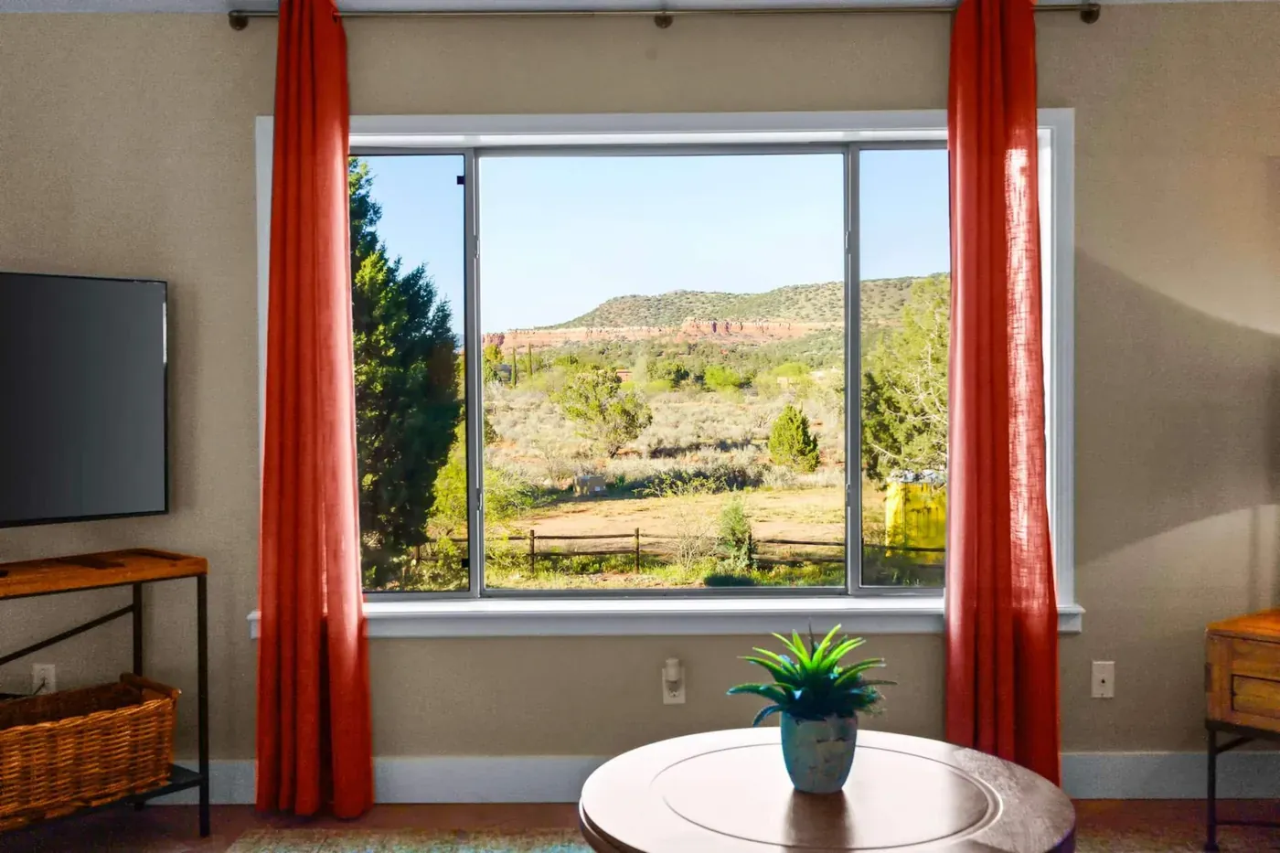 The view from the living room window across the high desert toward the red-rock hills of West Sedona