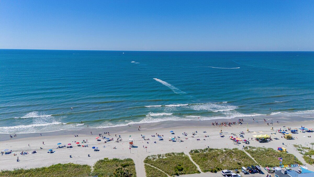 Aerial view of the wide North Myrtle Beach strand and Atlantic surf near Wait and Sea