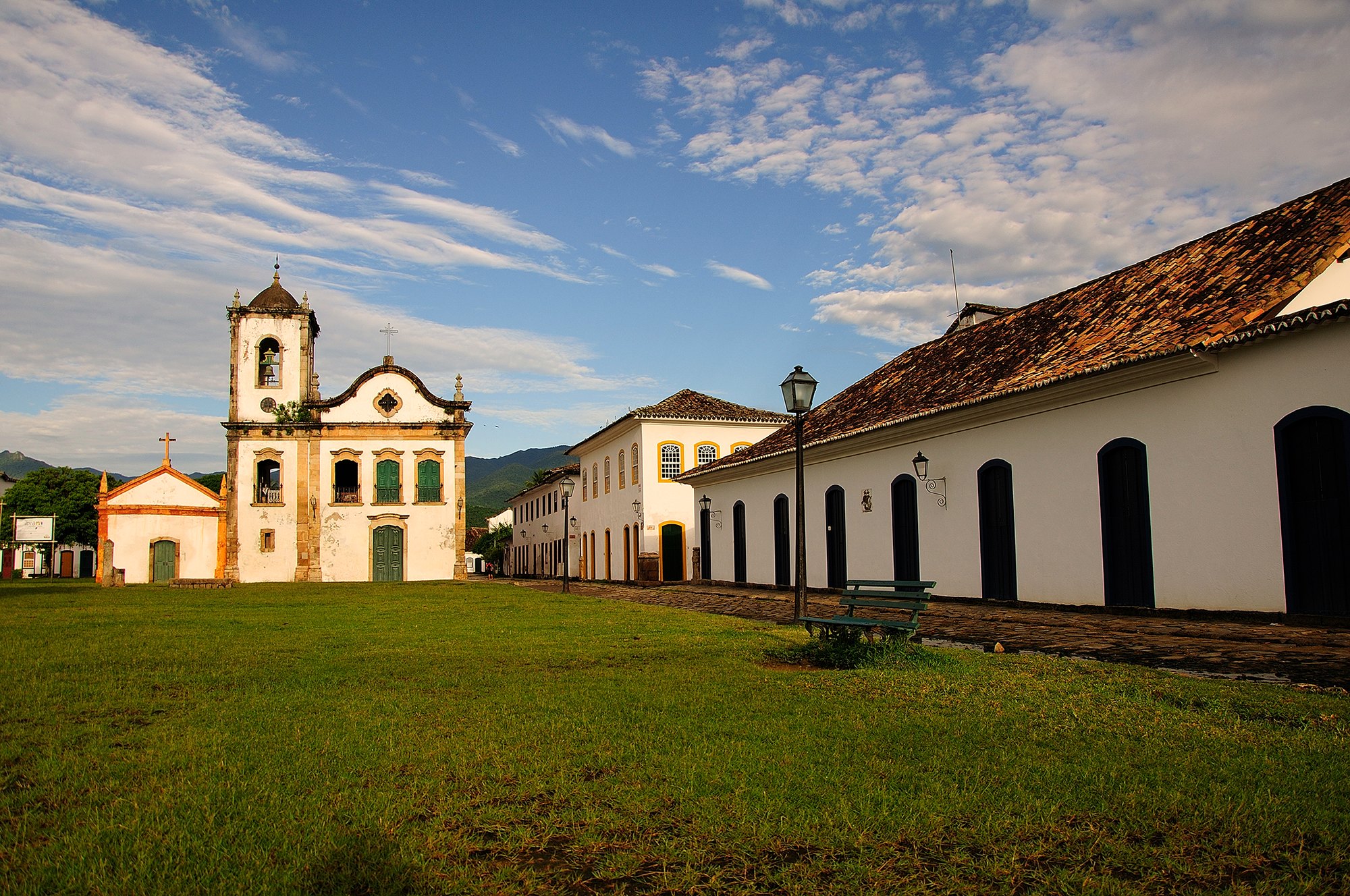 The Igreja de Santa Rita in Paraty, a small whitewashed colonial church with a bell tower, near the waterfront